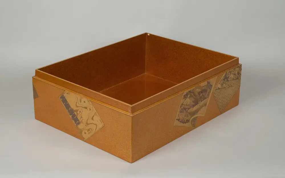 An empty open box base showing its folded inner walls